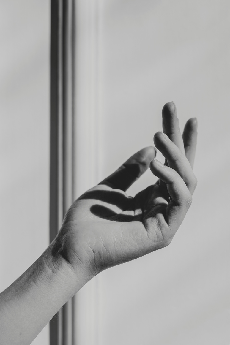 Black and White Photo of Person's Hand