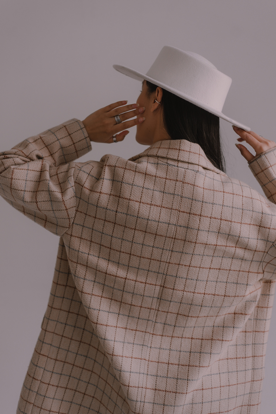 Back View of a Woman with a White Hat