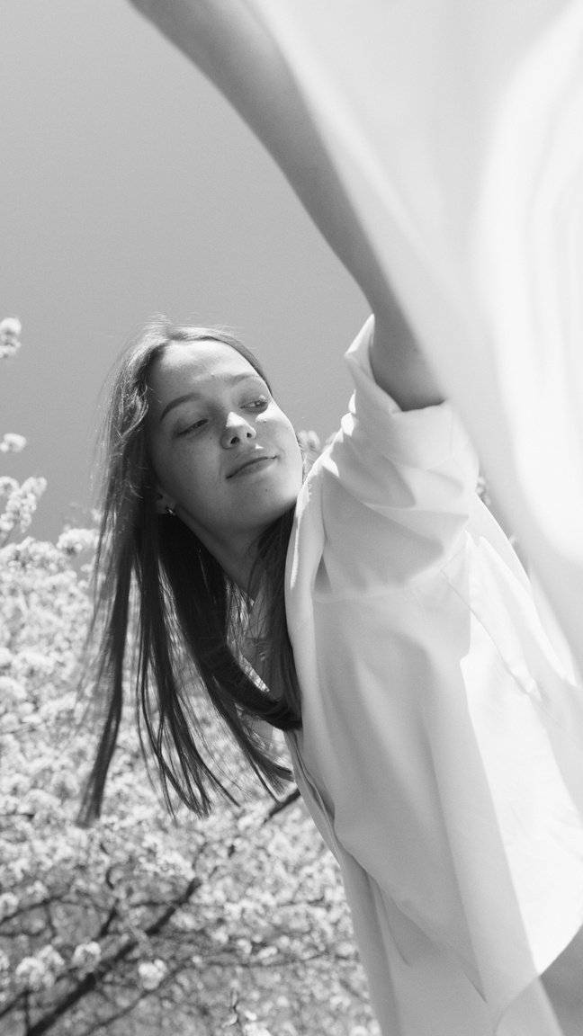 Grayscale Photo of a Woman in White Dress