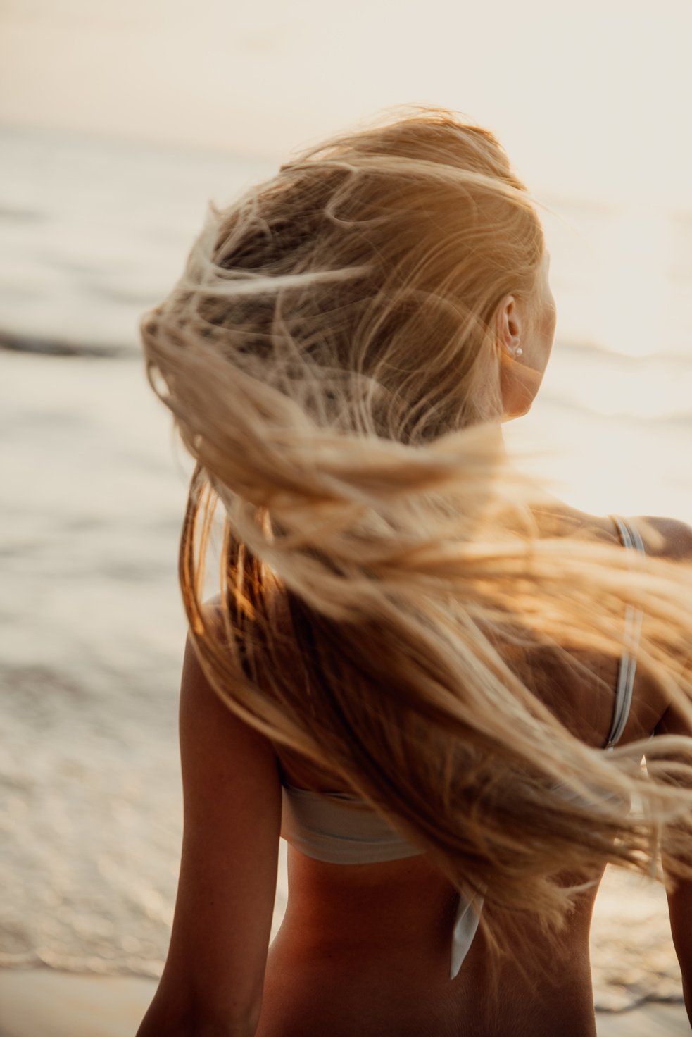 Back View of a Woman in a Bikini Flipping her Hair